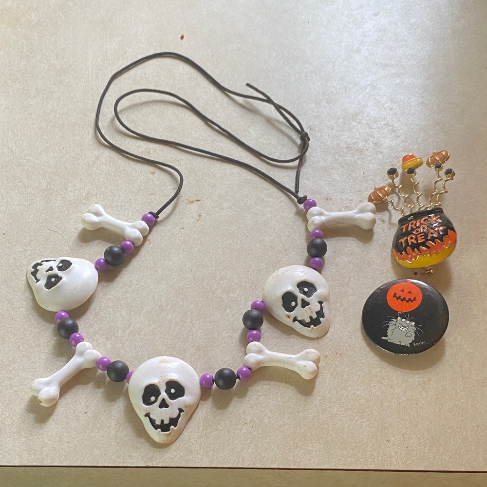 3/$15. Skull and bones necklace, Sandra Boynton pin, Trick or Treat pin